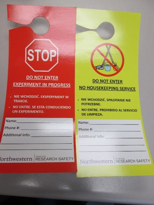 "do not enter experiment in progress" and "no housekeeping" doorknob signs